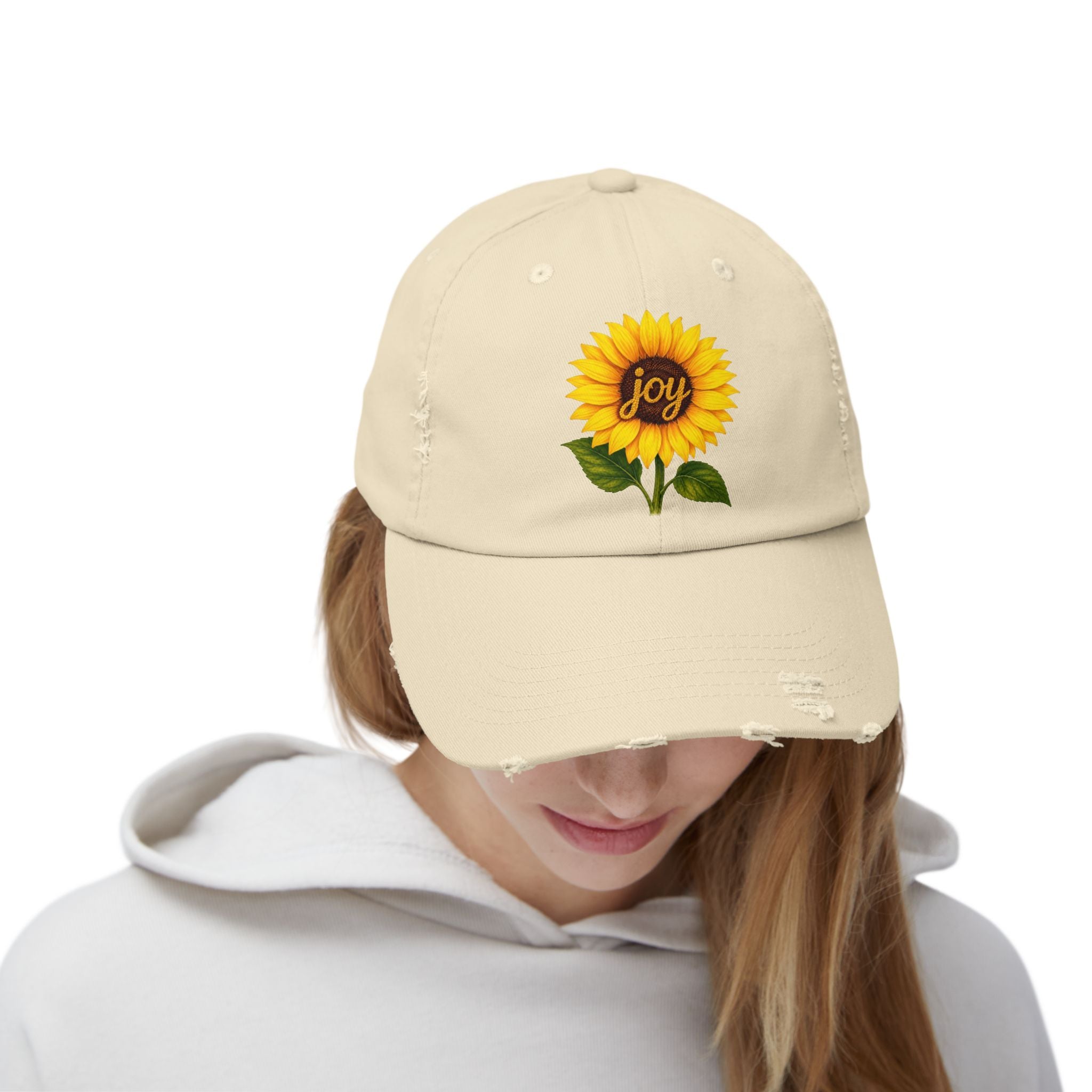 Sunflower Joy Distressed Cap featuring a hand-painted sunflower and the word joy on a distressed cotton base.
