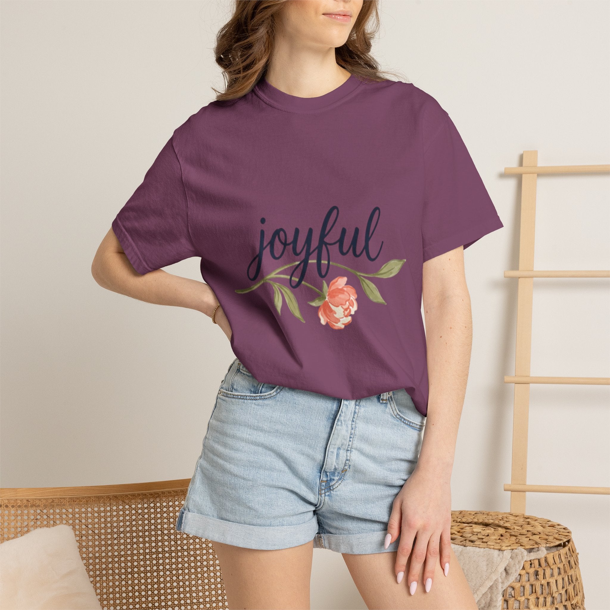 Joyful Flower T-Shirt for Women worn by a model with a floral design in a stylish indoor setting.