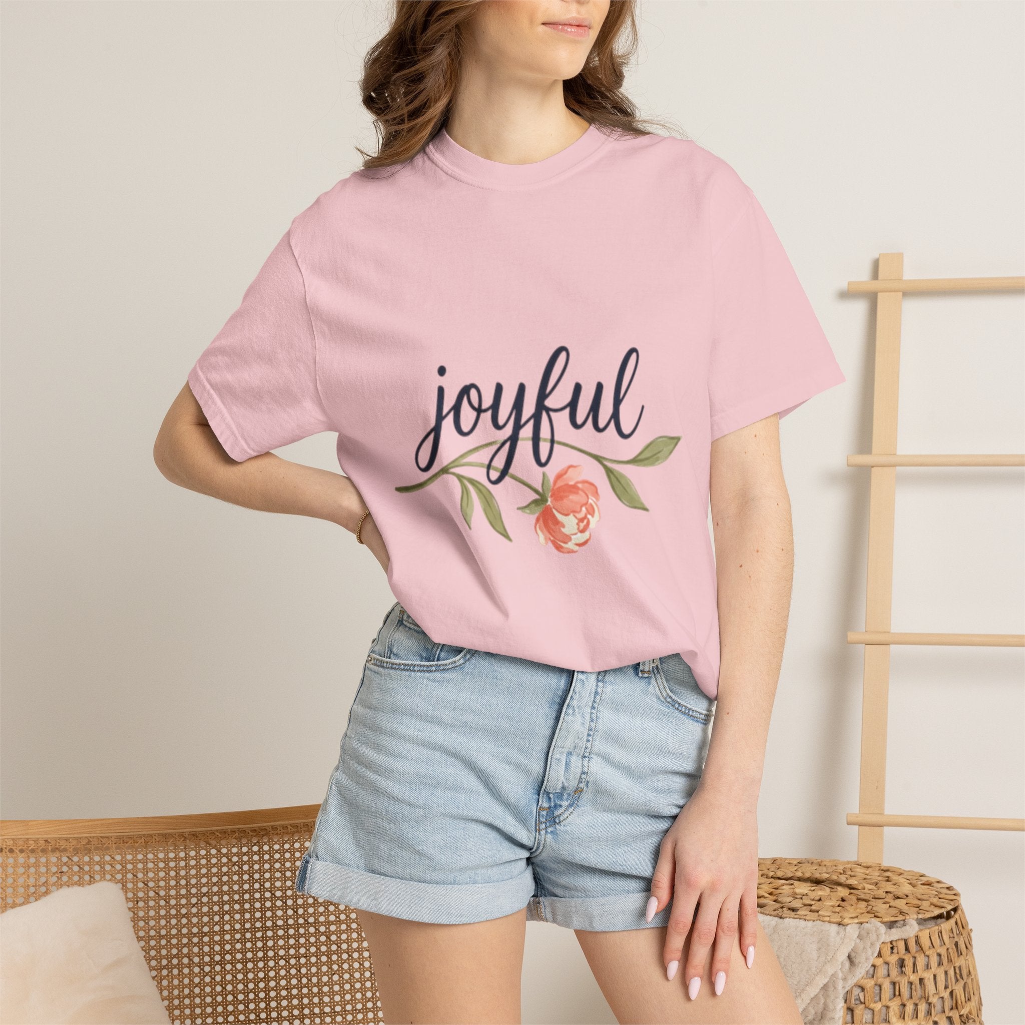 Joyful Flower T-Shirt for Women featuring a floral design, worn by a woman in a casual setting.