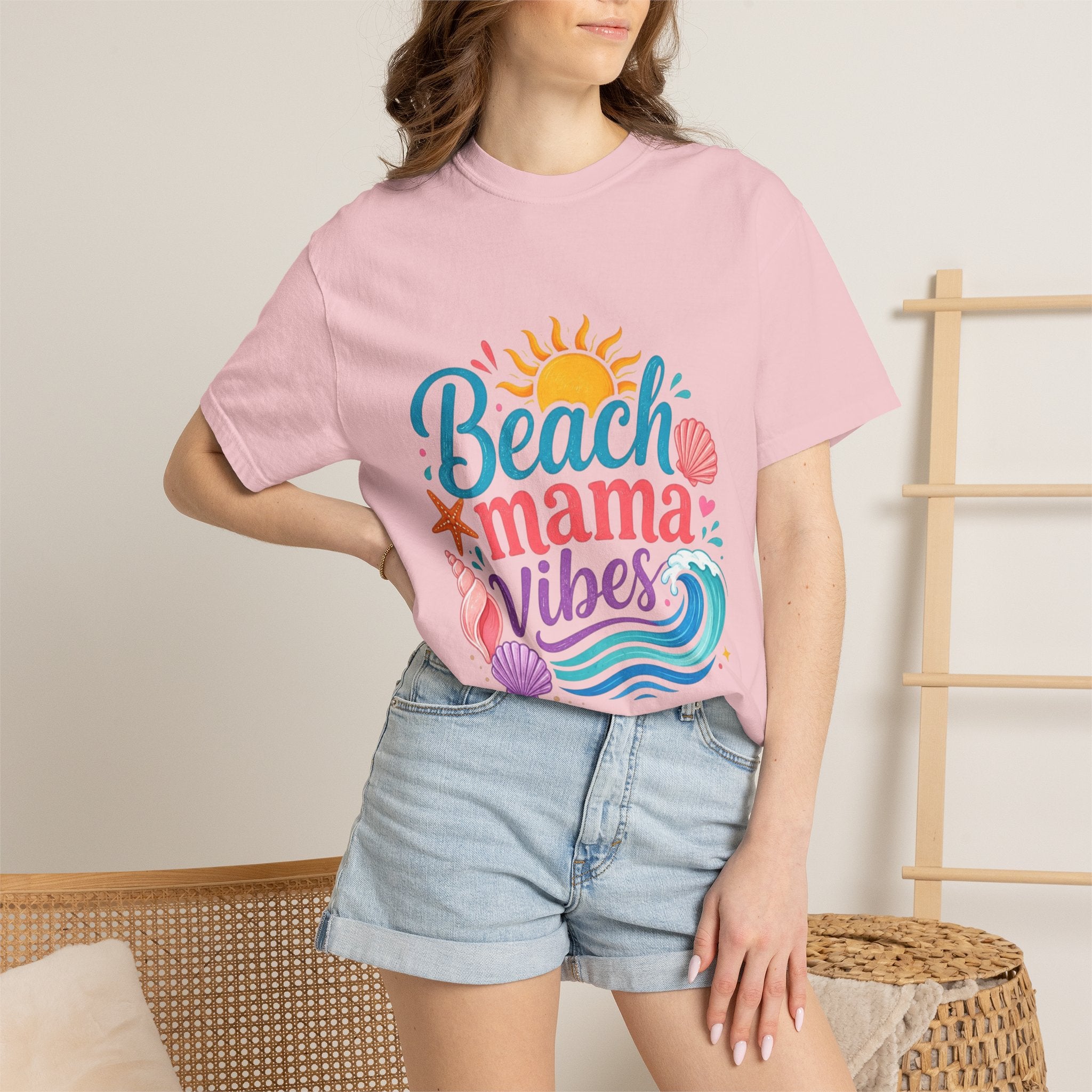 Beach Mama T-Shirt — Women's Coastal Mom Tee featuring a colorful beach-themed design on a pink background.