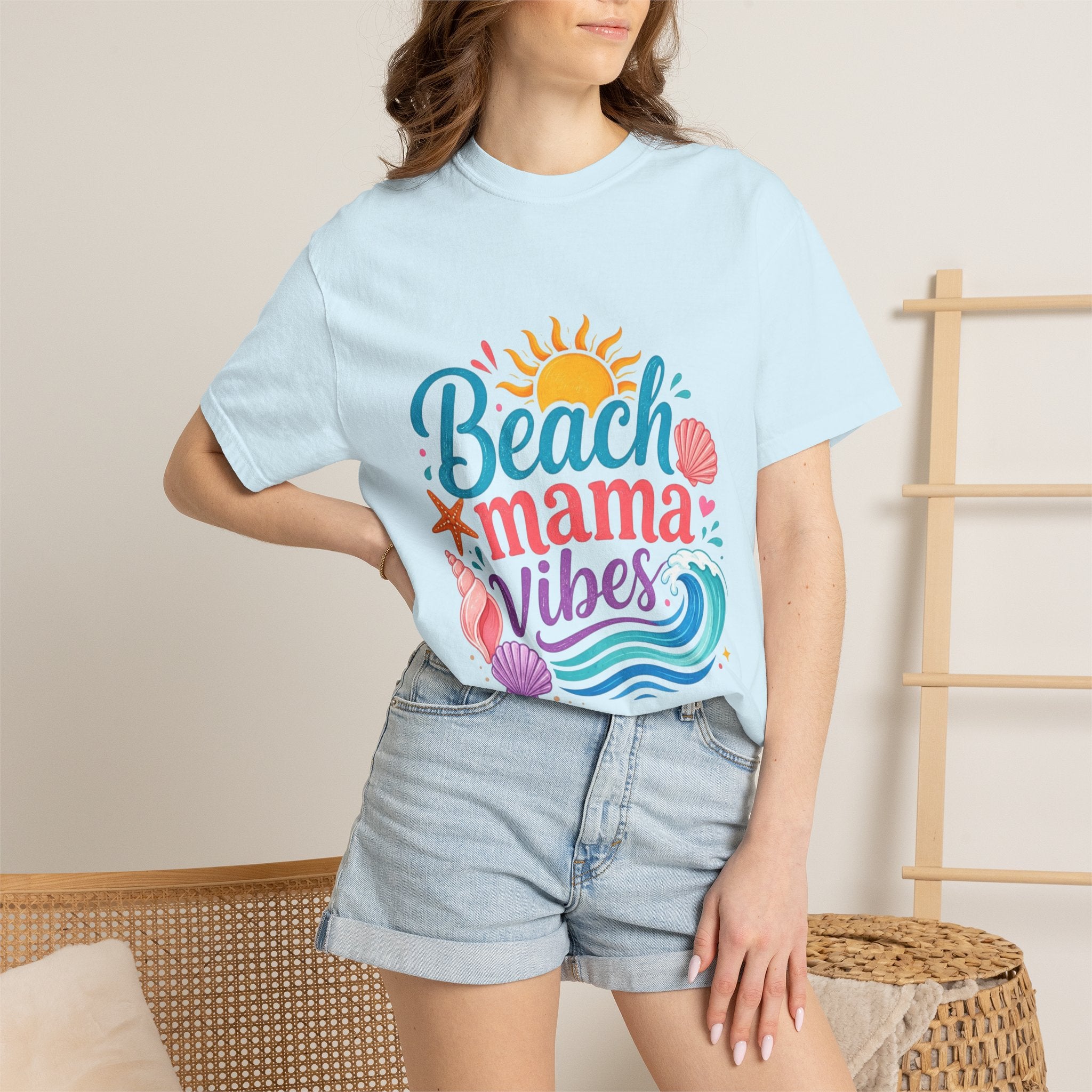 Woman wearing Beach Mama T-Shirt — Women's Coastal Mom Tee with vibrant design and casual shorts.
