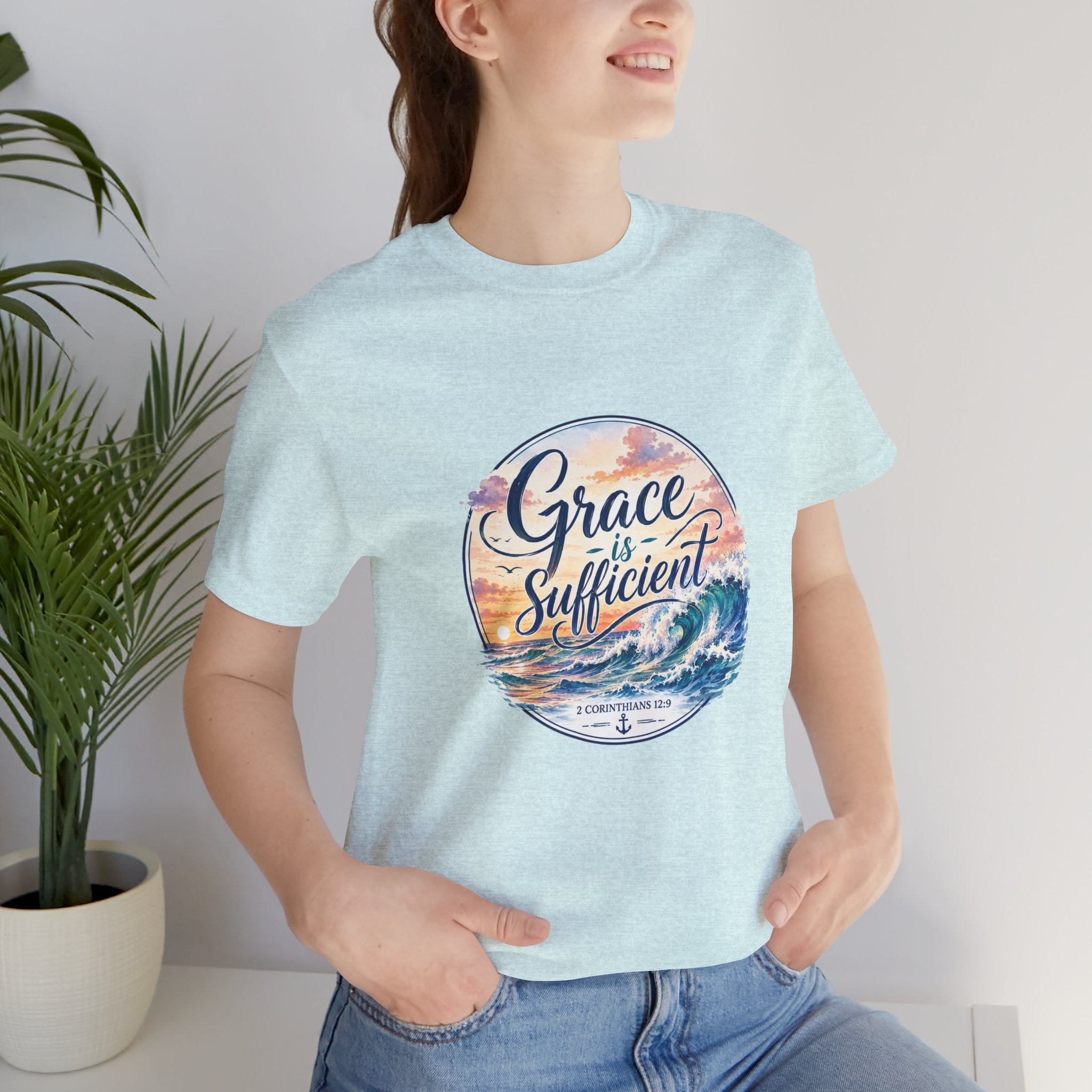Grace Is Sufficient Tee featuring a calming beach design and pastel sunset colors on a soft cotton t-shirt.
