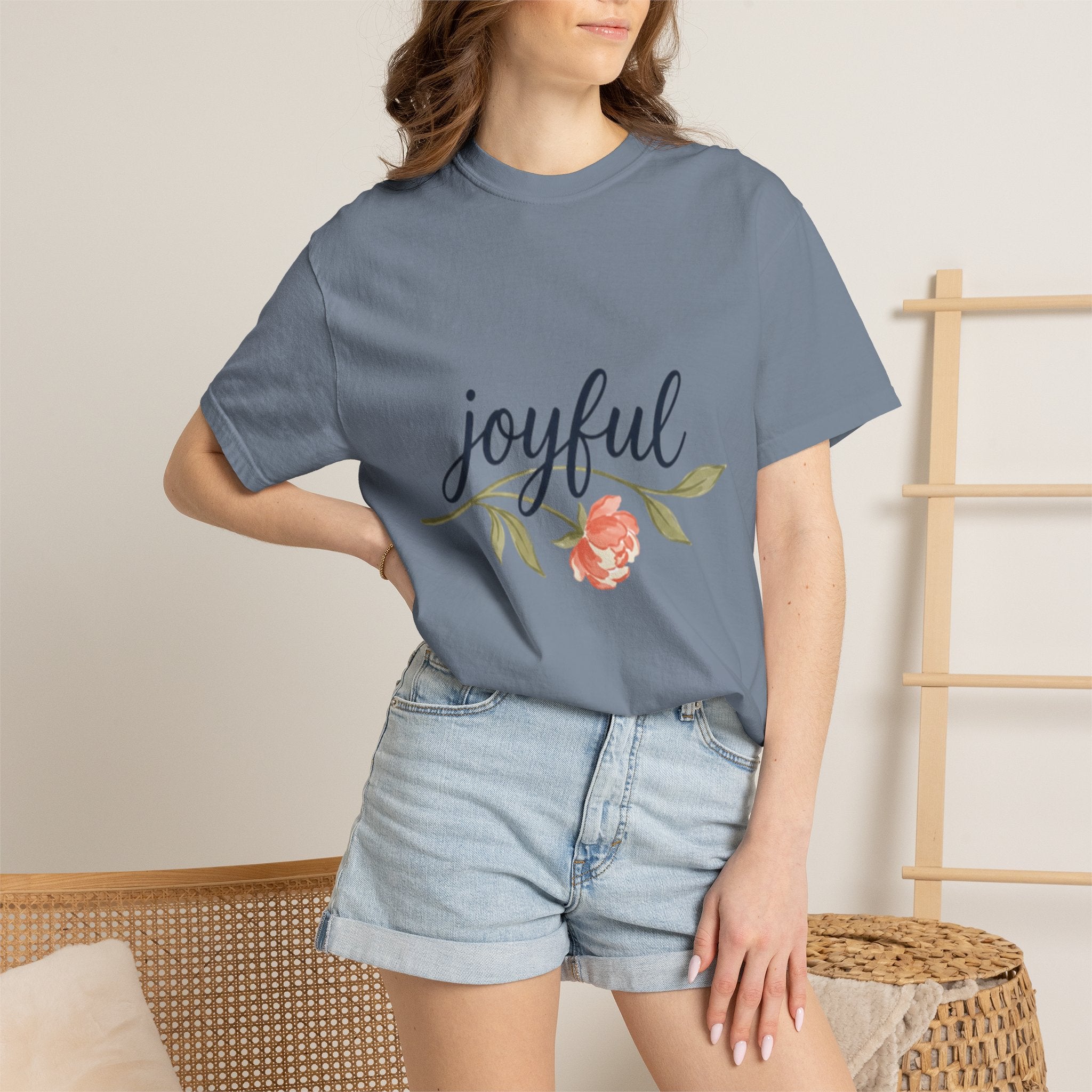 Joyful Flower T-Shirt for Women model wearing floral graphic tee with joyful design and denim shorts.