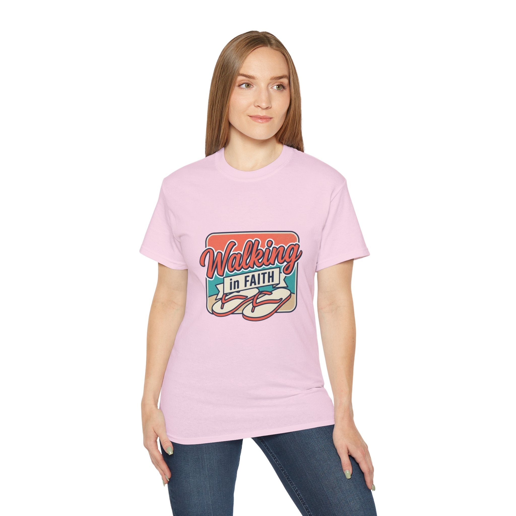 Walking in Faith Beach T-Shirt worn by a woman, featuring a colorful design and coastal theme.