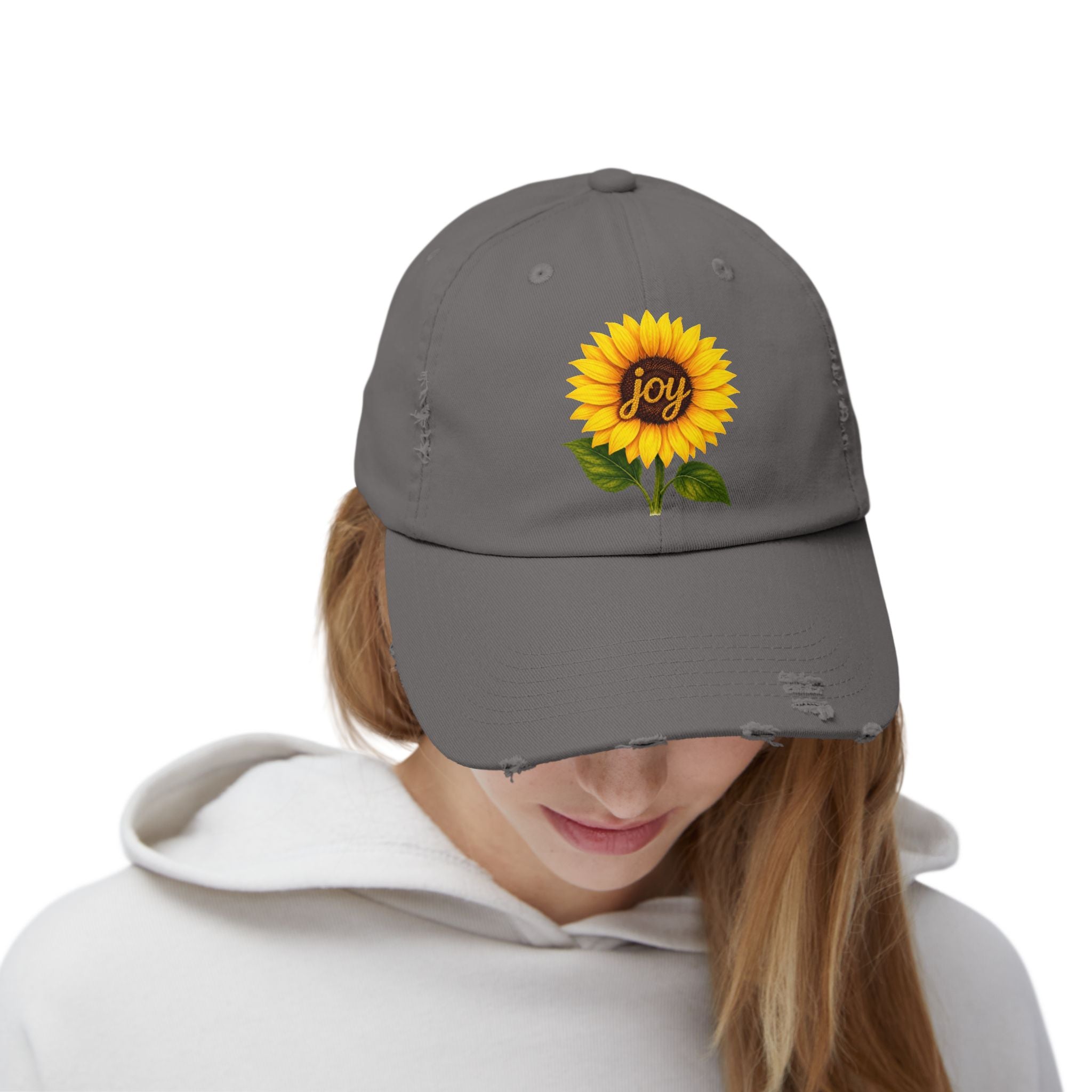 Sunflower Joy Distressed Cap featuring a hand-painted sunflower design with the word 'joy' on a gray cap.