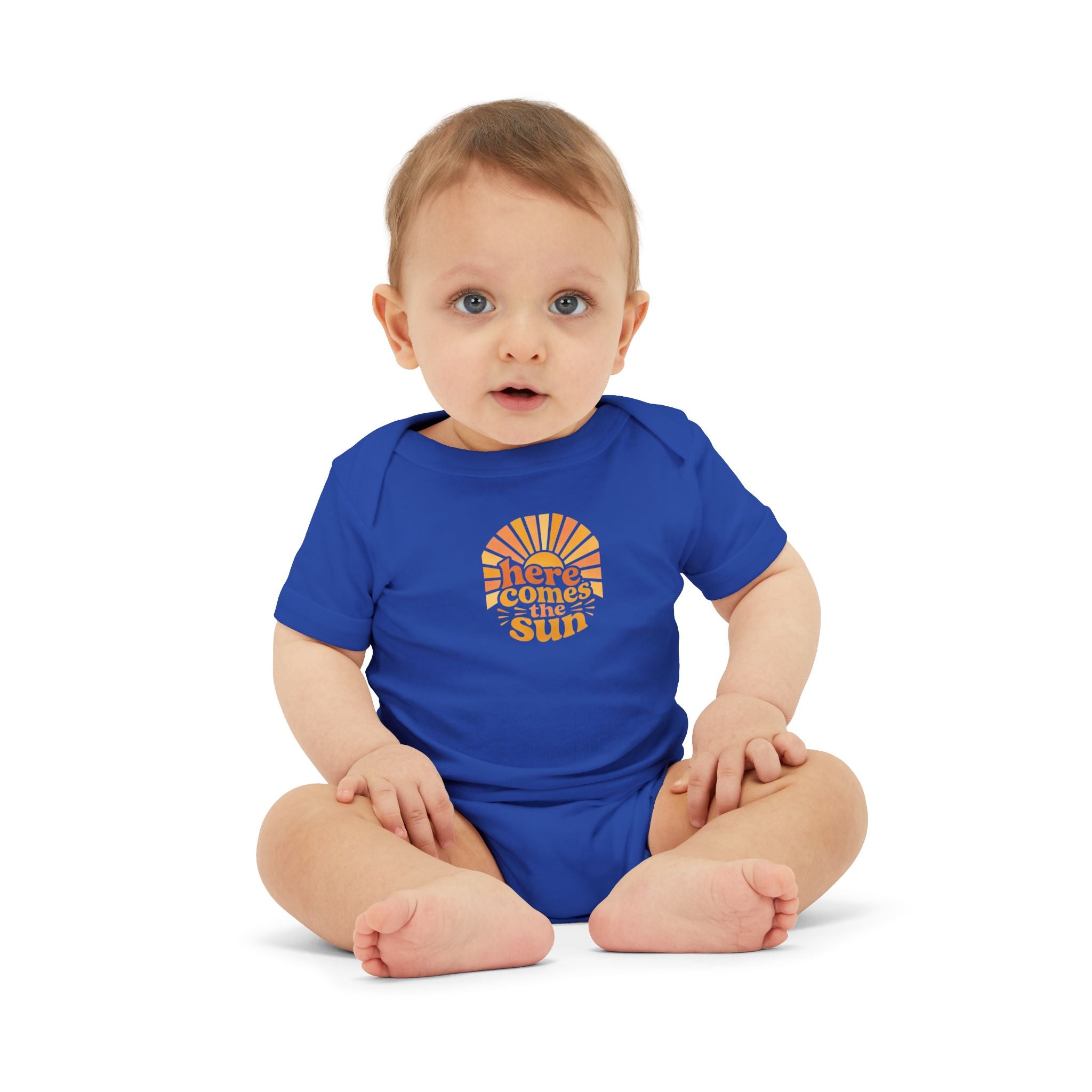 Cute Baby Bodysuit in blue with the phrase 'Here Comes The Sun' worn by an adorable infant.