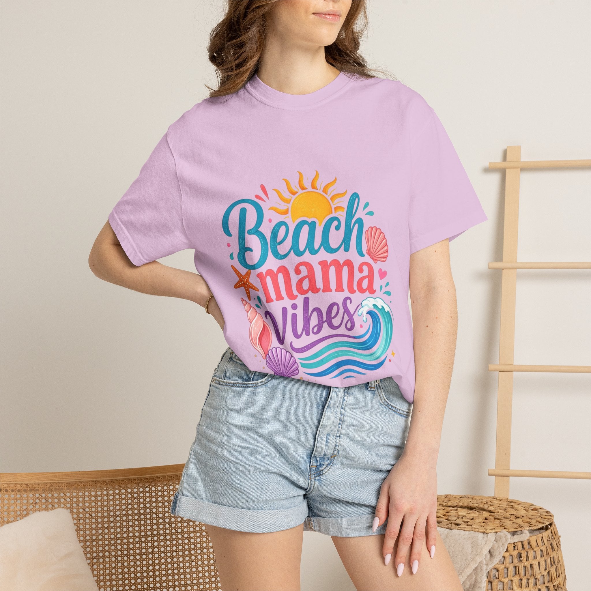 Beach Mama T-Shirt — Women's Coastal Mom Tee model wearing light pink shirt with beach-themed graphic design.
