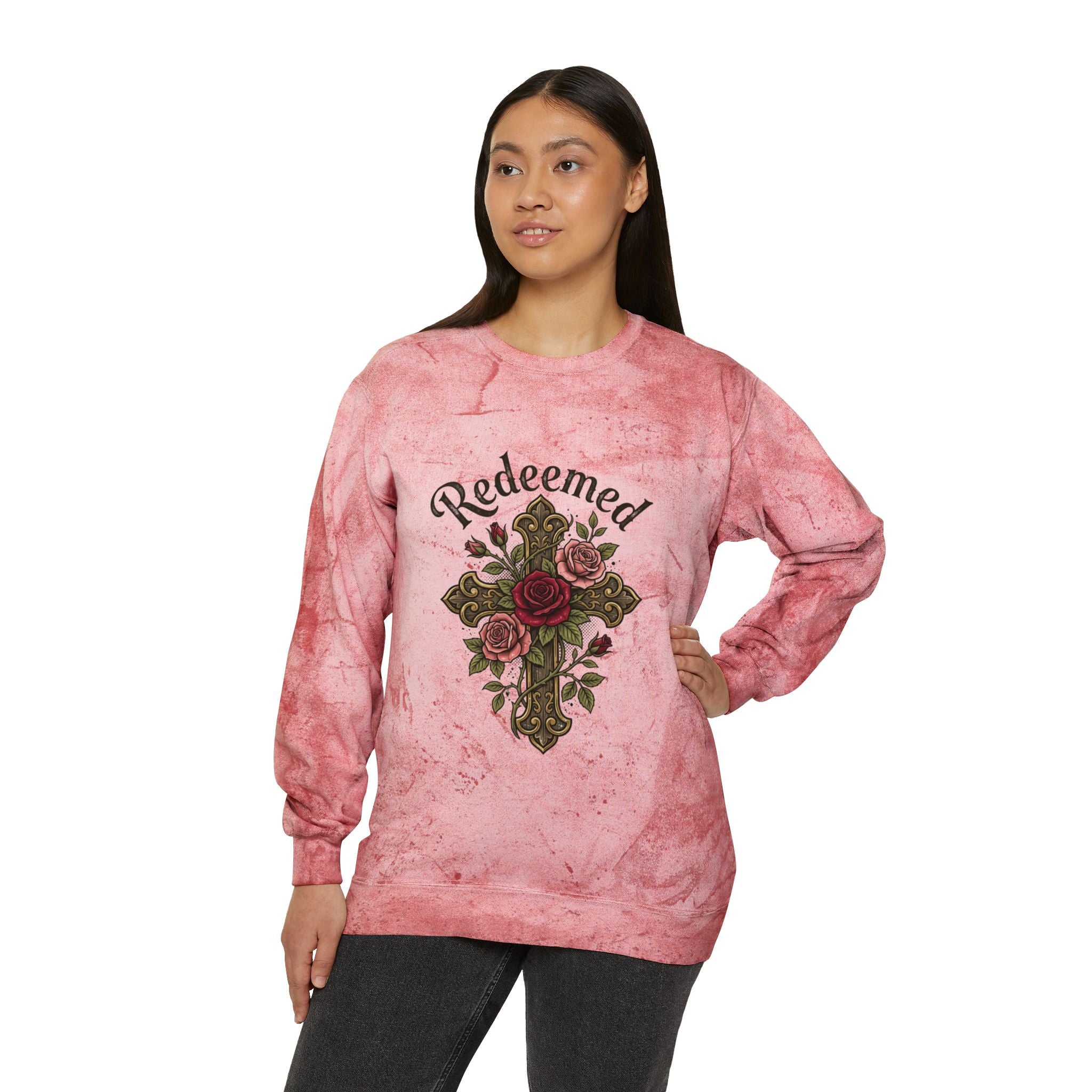 Christian sweatshirt featuring a hand-drawn cross with roses and the word 'Redeemed' on a vintage-style pink Tie-Dye  Pi crewneck.