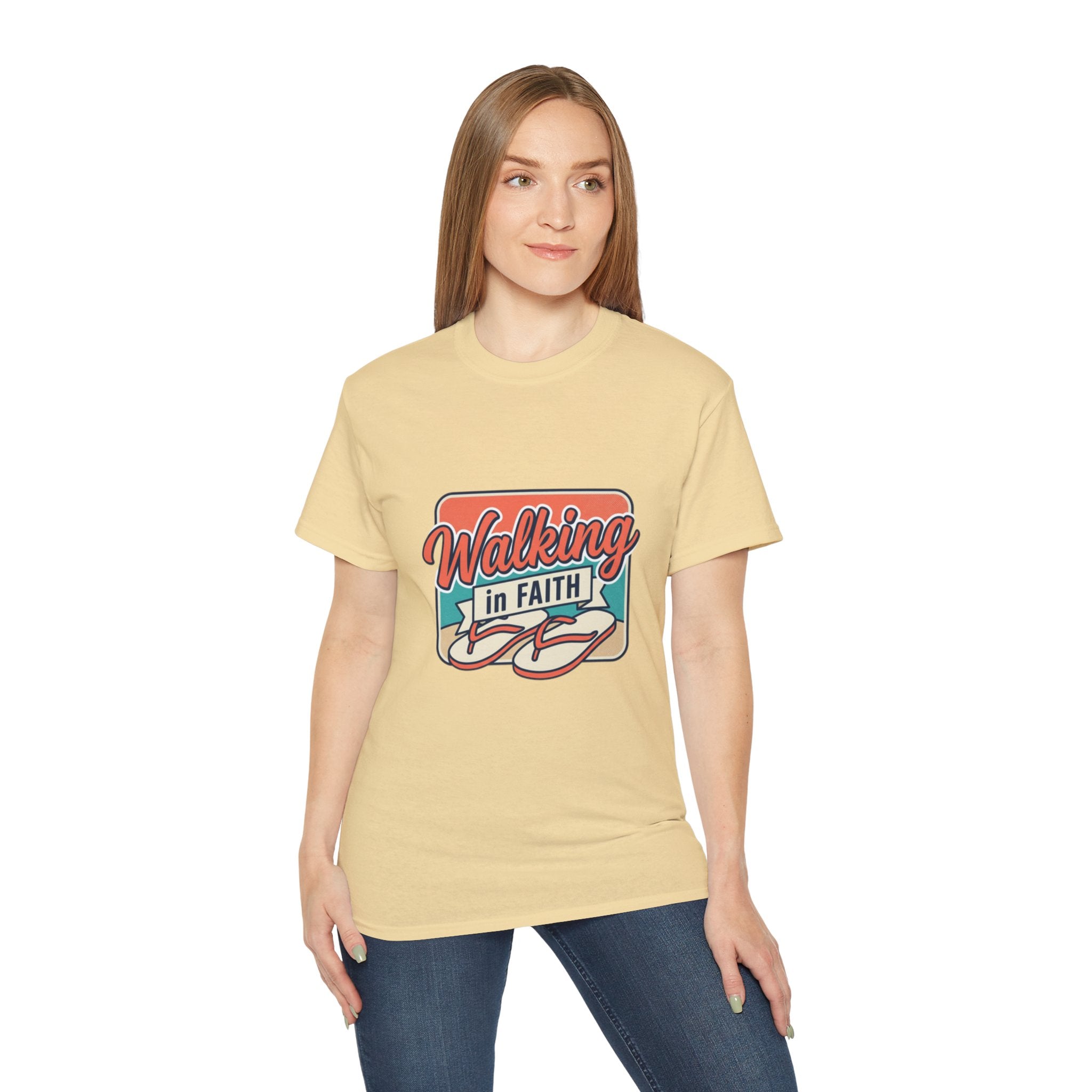 Model wearing a Walking in Faith Beach T-Shirt, featuring a coastal design and inspirational message.
