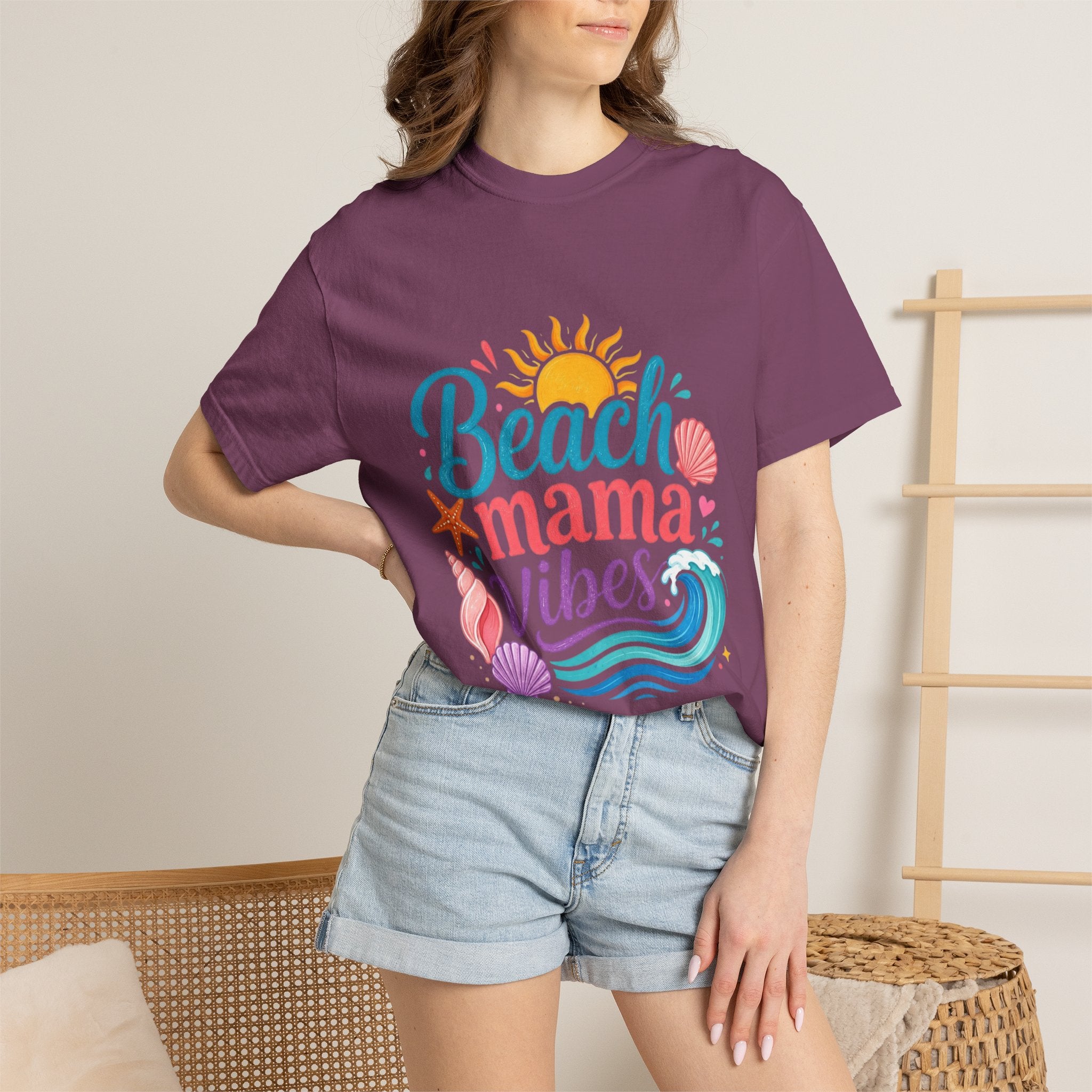 Beach Mama T-Shirt — Women's Coastal Mom Tee worn by a woman, showcasing a fun beach design with sun and waves.