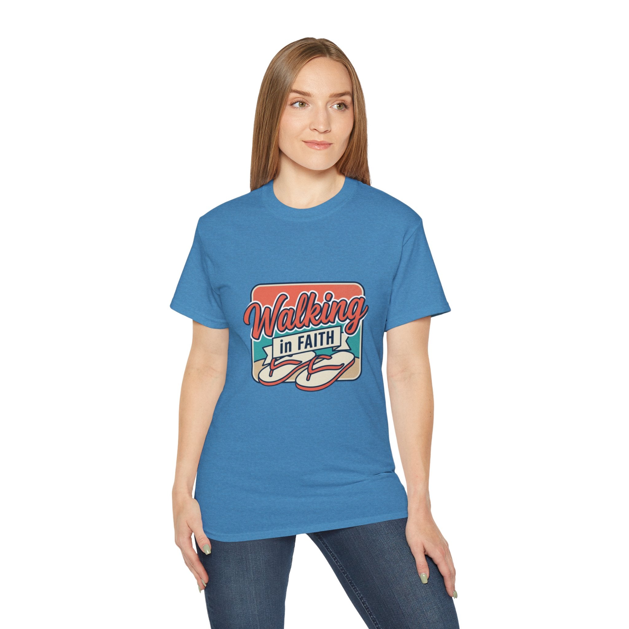 Walking in Faith Beach T-Shirt worn by a woman, showcasing a vibrant blue tee with a faith-inspired design.