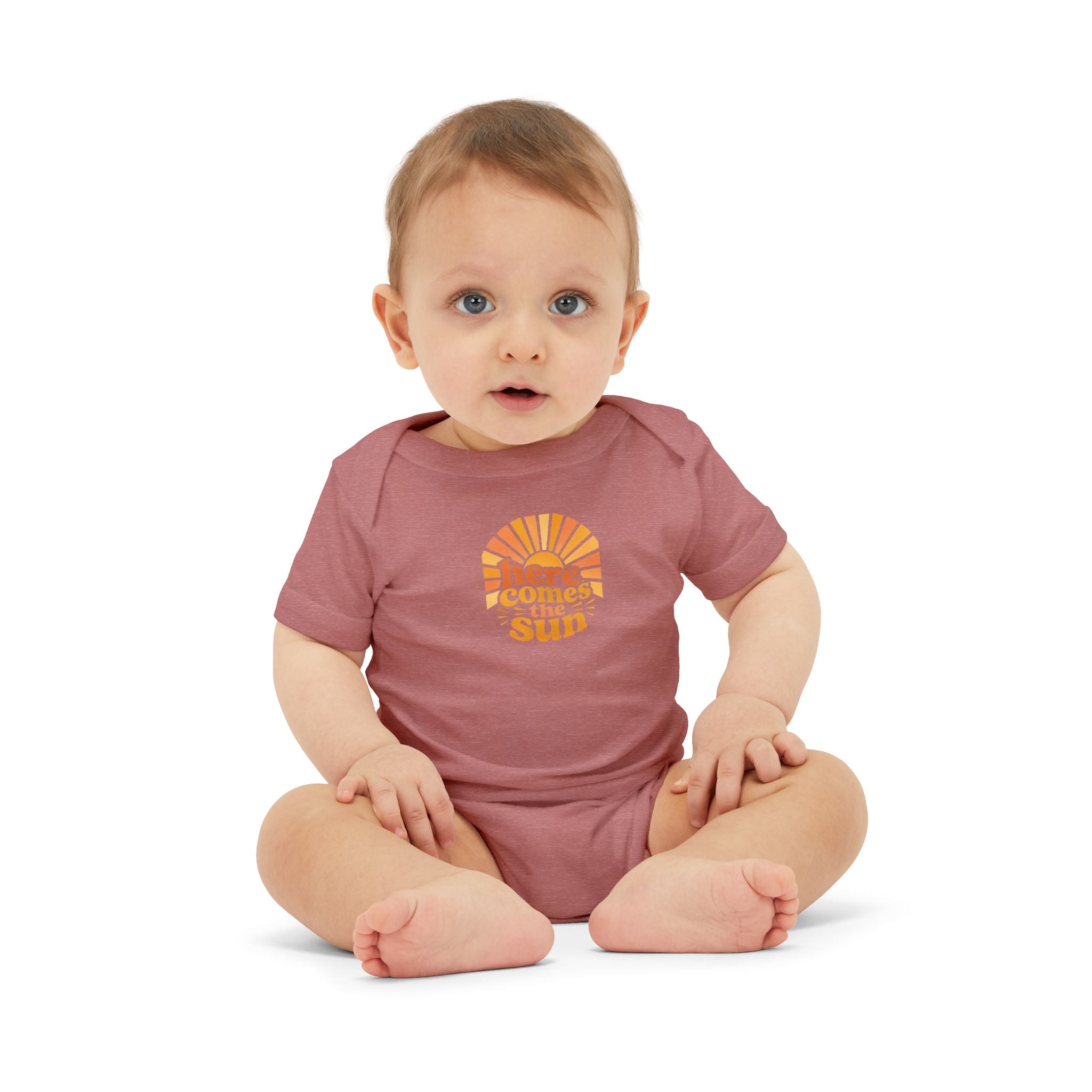 Cute Baby Bodysuit worn by an infant, featuring the phrase 'Here Comes The Sun' in bright colors.