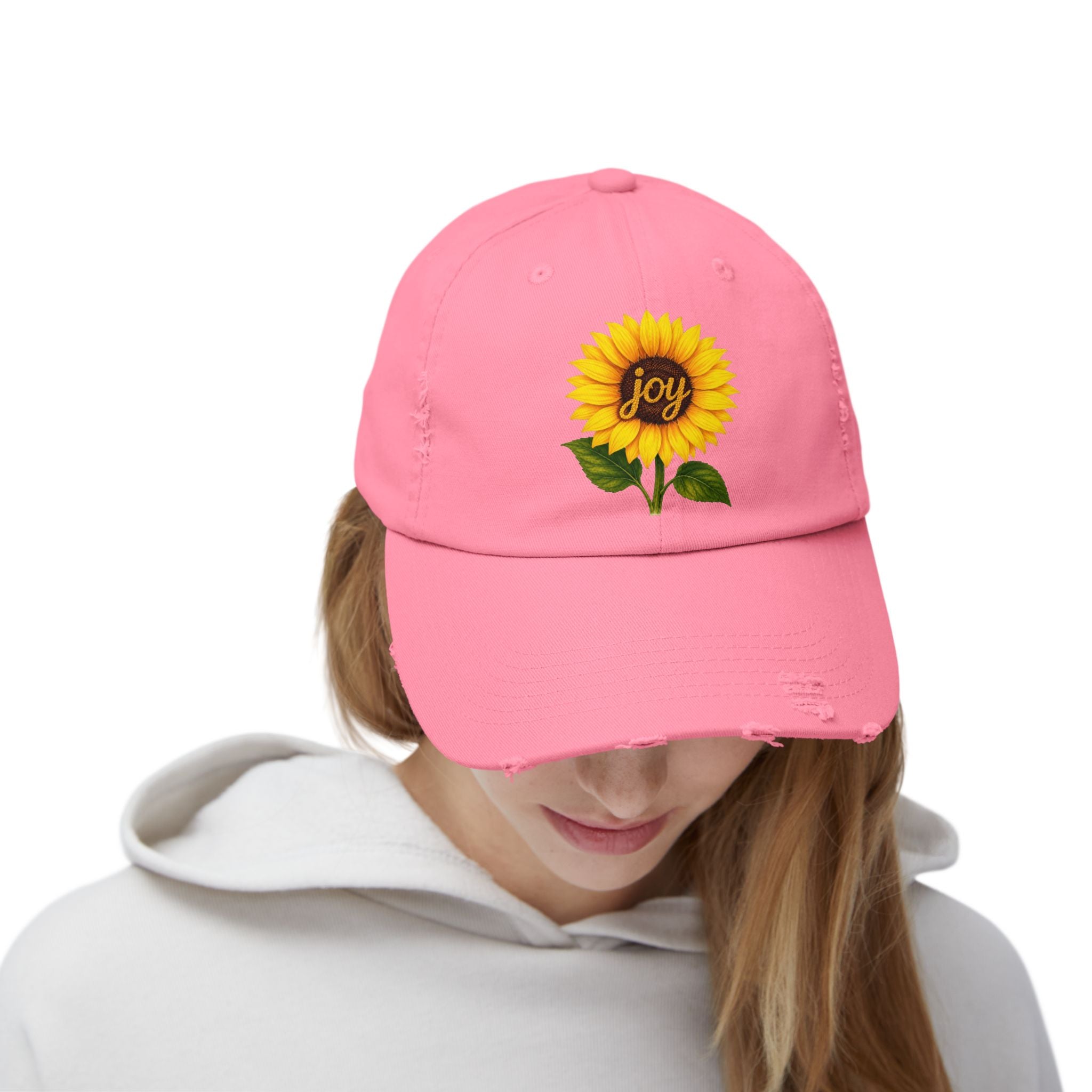 Sunflower Joy Distressed Cap displayed on a model, featuring a hand-painted sunflower and the word joy.