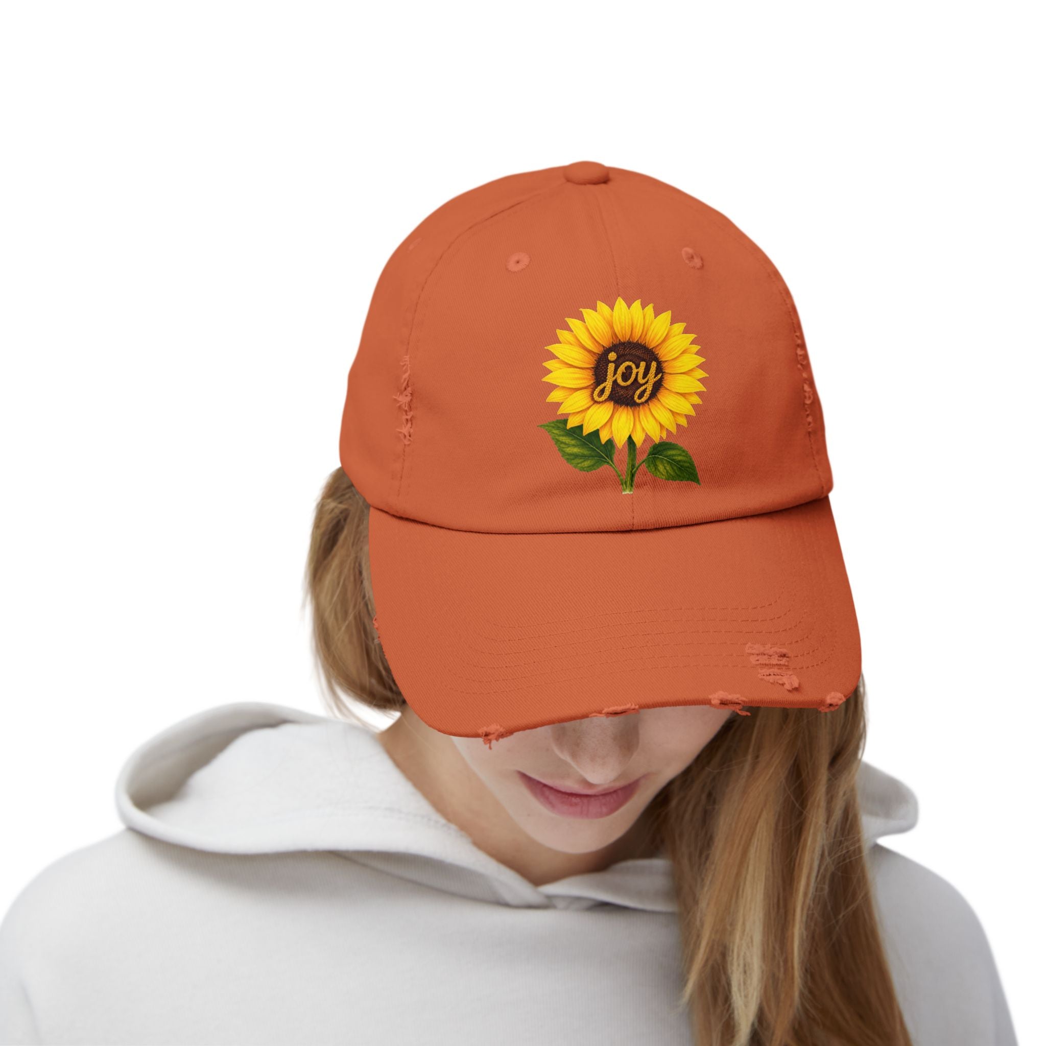 Sunflower Joy Distressed Cap featuring a hand-painted sunflower and the word joy on an orange cap