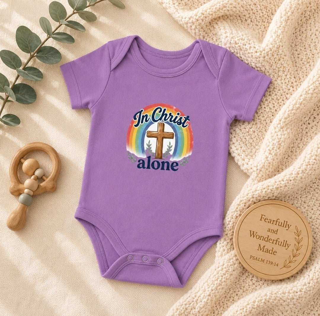 Infant bodysuit with In Christ Alone cross rainbow design
